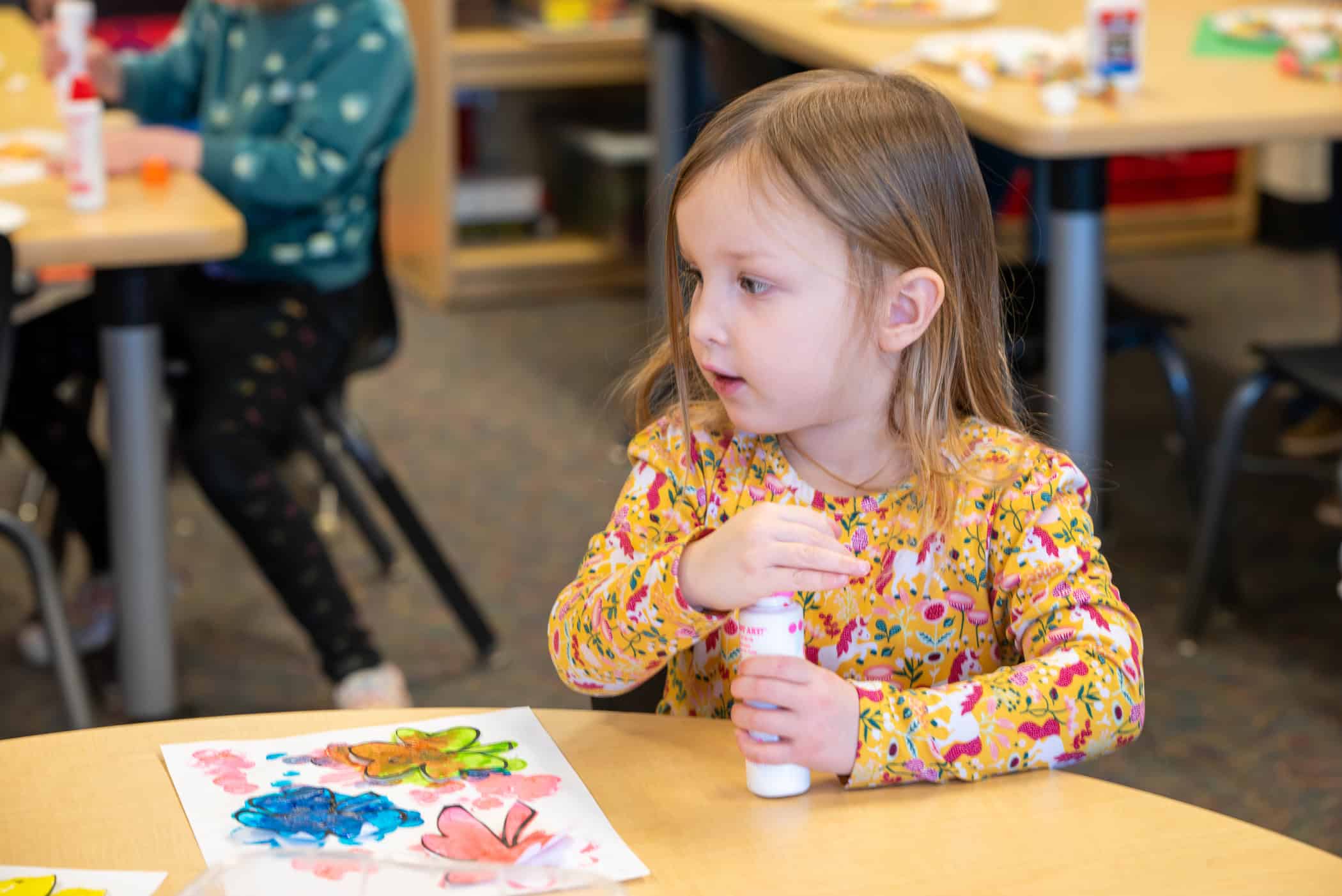 Longmont Estates Elementary preschool student painting in class